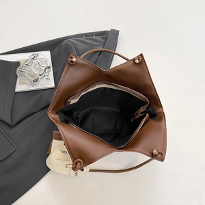 Brown faux leather tote bag with woven shoulder strap for women, 45-degree office view