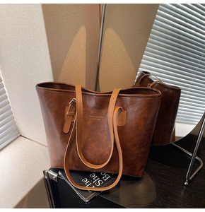 Detail of vintage brown tote bag texture with Fashion & Bag Leather printed text