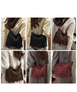 Detail view of large bohemian tassel hobo bags in black, coffee, and burgundy colors