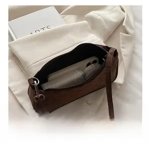 Interior storage capacity showing smartphone and card wallet inside brown leopard bag