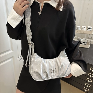 Silver metallic pleated hobo bag with butterfly buckle and Y2K aesthetic style