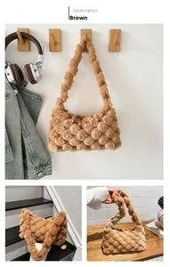 Detail of a brown plush tote bag with a unique bubble texture and soft faux fur material