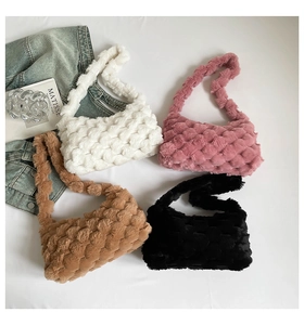 Flat lay of chunky woven plush crossbody bags in white, pink, camel, and black