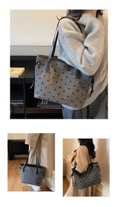 Détail du sac cabas gris à pois avec broderie de nœud noir et anses en cuir élégantes
