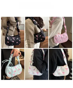 Detailed views of floral handbags in black, pink, blue and white with ruffled straps