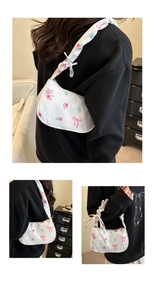 Detailed views of floral underarm bag with pink rose patterns and bow shoulder strap