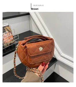 Close-up of brown quilted leather bag featuring a gold camellia floral metal clasp