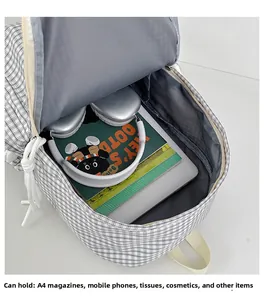 Internal view of a large capacity plaid backpack showing laptop and books storage