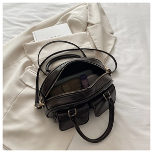 Interior view of vintage bowling bag showing storage space for tablet and wallet