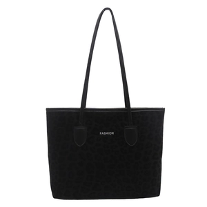 Front view of large black leopard print tote bag with thin shoulder straps and Fashion text