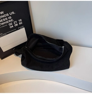 Internal view of minimalist black canvas tote bag with large capacity and zipper closure