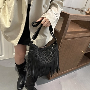 Vintage black leopard print shoulder bag with long fringes and adjustable strap for women