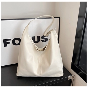 Detail of white PU leather Hobo bag featuring adjustable strap and metallic buckle