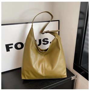Detail of olive green PU leather hobo bag with adjustable strap and vertical stitching