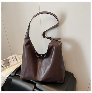 Detailed view of deep brown faux leather Hobo bag with stylish vertical stitching