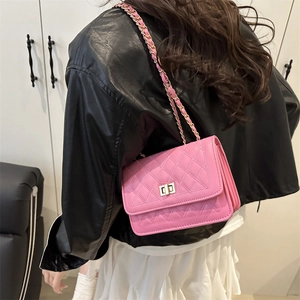 Pink quilted crossbody bag with gold chain strap and metal turn-lock for women