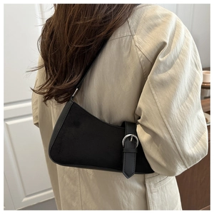 Chic black shoulder bag with suede and leather patchwork shown on model back view