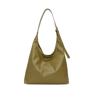 Detail view of olive green faux leather tote bag with vertical stitching and adjustable strap