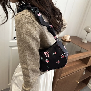 Floral black shoulder bag with scrunchie strap and cute pink flower bow patterns