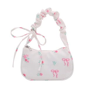 Floral canvas underarm bag with pink roses and ruffled handle on white background