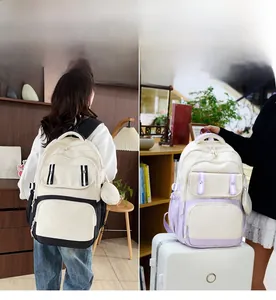 Detailed comparison of multi-pocket canvas backpacks in black and purple with round pouch