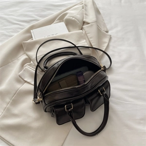 Chic vintage bowling bag in dark coffee leather with large capacity and dual outer pockets