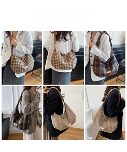 Detail view of large woolen plaid crossbody bags in six different vintage colors