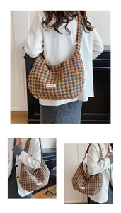Detail of multi-color plaid knit Hobo bag with vintage check pattern and logo patch