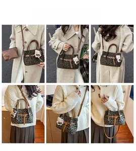 Detailansicht der großen Leopard-Beuteltasche mit braunen Riemen und passender Tasche
