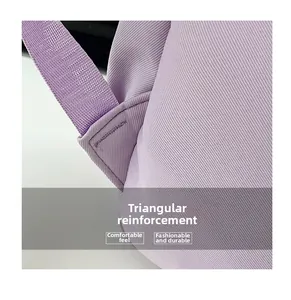 Detail of reinforced triangle stitching on light purple polyester student backpack straps