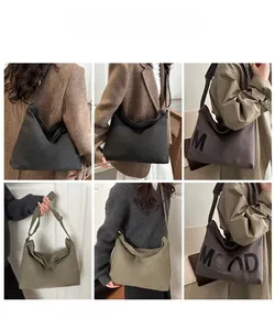 Detailed views of high-capacity canvas tote bags with MOOD print in various earth tones