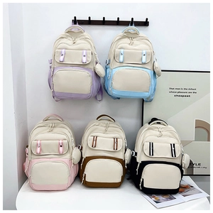 Close-up of stylish canvas backpacks in multiple pastel colors with functional pockets