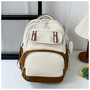 Detail of trendy color-block backpack in beige and brown with side round pouch