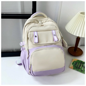 Close-up of student backpack in cream and lavender with multiple utility pockets