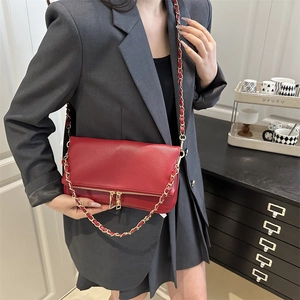 Red lychee pattern leather shoulder bag with gold chain and dual zipper accents
