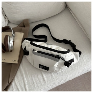 Detail of white waterproof sports waist bag with adjustable strap and reflective stripe