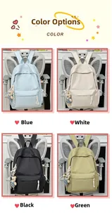 Detail view of the nylon backpack color options with cute bear charms and woven zip pulls