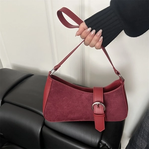 Minimalist wine red suede crescent shoulder bag with silver buckle and leather strap
