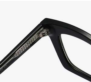 Macro shot of durable metal hinge and CE certification mark on black acetate eyewear frames