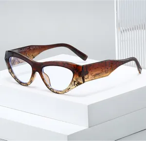 Detail view of cat eye glasses with dark brown tortoiseshell texture on wide temples