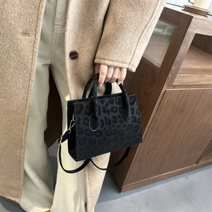 Chic leopard print crossbody tote bag with gold hardware and top handle for women