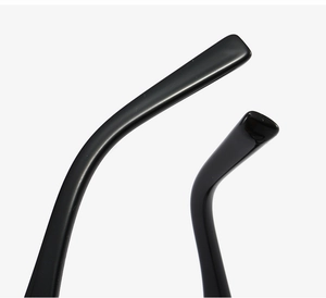 Macro shot of polished black resin temple tips and curved ear hook detail for cat eye glasses