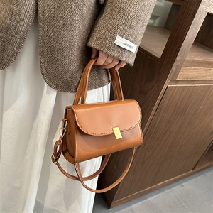 Vintage caramel brown PU leather crossbody bag with golden buckle for casual wear