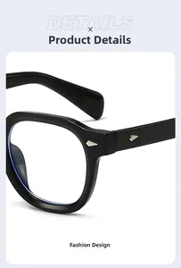Detail shot of black thick frame sunglasses featuring decorative silver rivets on the hinges
