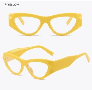 Detail view of yellow cat-eye glasses frame with geometric design and wide temples