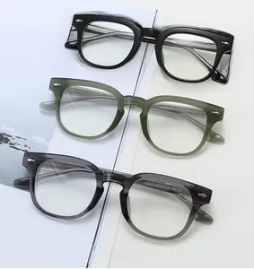 Close-up of TR90 glasses frames with silver arrow rivets in black, green and grey