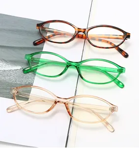 Detailed top view of retro oval frames in tortoiseshell, emerald green, and amber colors