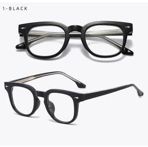 Detail view of glossy black TR90 glasses frame with silver arrow metal accents