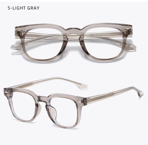 Detail view of transparent light gray TR90 square glasses frames with metal rivets