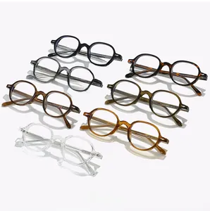 Close-up of retro oval blue light glasses frames in multiple colors with metal rivets